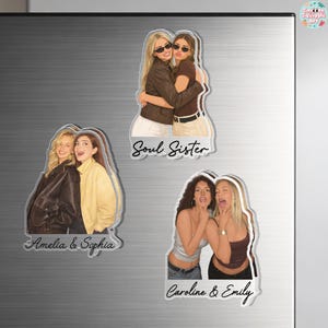 May include: Three custom magnets featuring illustrated pairs of friends. One magnet shows two people hugging with the text Soul Sister. Another shows two people with the text Amelia & Sophia. The third shows two people with the text Caroline & Emily.