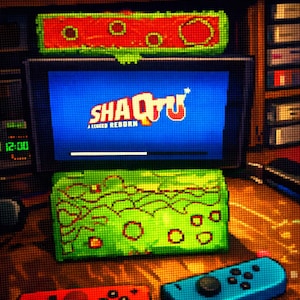 May include: A pixelated image of a gaming console with a screen displaying "Shaq-Fu: A Legend Reborn." The console has red and blue controllers. The scene includes a green and red controller, and a shelf with other electronic devices.