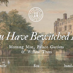 May include: A soy candle with a scenic watercolor design. The image features a lake scene with a castle, bridge, and text that reads "You Have Bewitched Me". The candle is 8oz and hand-poured.