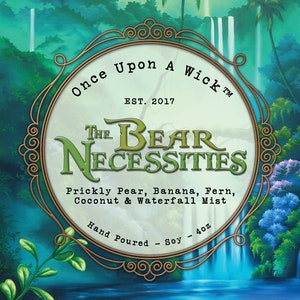 May include: A candle label with a tropical rainforest scene in shades of green and blue. The label reads "Once Upon A Wick" and "The Bear Necessities". It lists scents like Prickly Pear, Banana, and Coconut. The label also states "Hand Poured - Soy - 4oz."