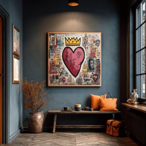 May include: A framed artwork featuring a large pink heart with a gold crown, surrounded by colorful graffiti-style drawings. The artwork hangs above a wooden bench with orange pillows and a leather bag. The room has dark blue walls and a wooden floor.