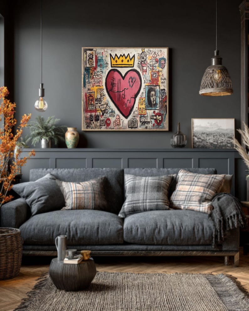 May include: A living room scene featuring a gray sofa with plaid and solid throw pillows, a woven rug, and a dark wood coffee table. A large framed artwork with a heart and crown design hangs above the sofa. Decorative lamps and plants complete the cozy interior.