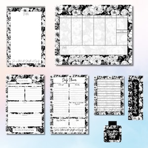 May include: A collection of stationery items featuring a black and white floral pattern and the text She is clothed with Strength and Dignity. The set includes a weekly planner, daily planner, church notes, a notepad, a bookmark, and a square tag.