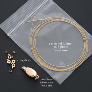 May include: A jewelry-making kit with gold-plated steel wire, crimp beads, and a lobster clasp. The wire is 1 meter long and 0.4mm thick. The clasp measures 16 x 6 mm. Includes 4 crimp beads.