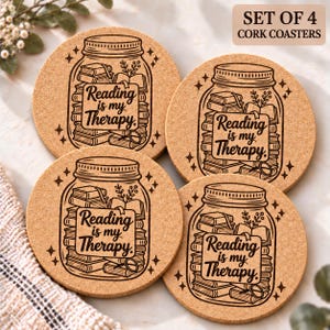 May include: A set of four round cork coasters, each featuring a black line art illustration of a mason jar filled with stacked books and a small plant. The text Reading is my Therapy is printed in the center of each jar design.