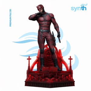 May include: A red and black Daredevil figurine stands on a red, gothic-style base. The figure is in a fighting pose, wearing a detailed costume and mask. The text "PREMIUM FILE 3D" and "synth" are visible.