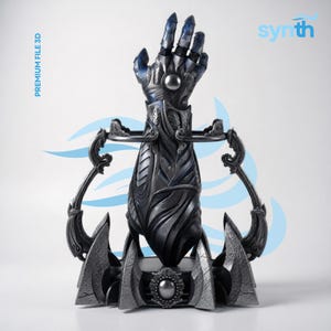 May include: A detailed, metallic sculpture of a hand, with intricate designs and blue accents on the fingertips. The sculpture has a stylized, futuristic aesthetic. The base features decorative elements and the text "PREMIUM FILE 3D" and "synth".
