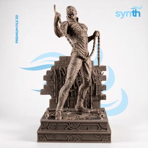 May include: A detailed brown statue of a humanoid figure holding a chain and key, standing before a crumbling brick wall. The statue has intricate details and is mounted on a decorative base. The text "PREMIUM FILE 3D" is visible.