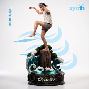 May include: A detailed 3D-printed statue of a figure in a karate stance, balanced on a wooden post above stylized ocean waves. The base features the text "The Karate Kid". The figure wears a white tank top and gray shorts. The word "synth" is visible.