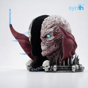 May include: A detailed 3D-printed sculpture of a monstrous figure with a skull-like face, glowing blue eyes, and a dark, cape-like structure. The figure is predominantly red and white, with a base featuring skulls and chains. The word "synth" is in the upper right corner.