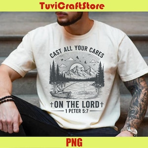 Puede incluir: Camiseta color crema con un gráfico en blanco y negro de un pescador en un bote en un lago, montañas y el texto "CAST ALL YOUR CARES +ON THE LORD+ 1 PETER 5:7". La camiseta tiene mangas cortas.