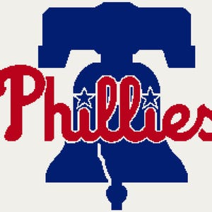 May include: A blue Liberty Bell graphic with the word "Phillies" in red script. Two white stars are inside the bell. The design is on a white background, representing the Philadelphia Phillies baseball team.