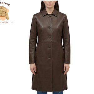 May include: A long, dark brown leather coat with a button-up front and a collared neckline. The coat extends to the knees and has a tailored fit. The image includes a logo that says "California leather jackets".