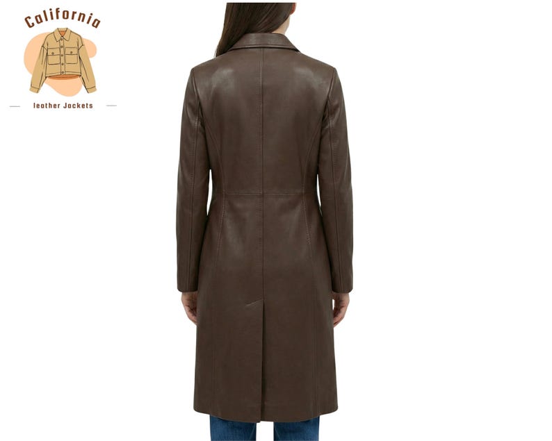 May include: A brown leather coat with a notched collar and a long, tailored silhouette. The coat extends to the knees and features a back vent. The California Leather Jackets logo is in the upper left corner.