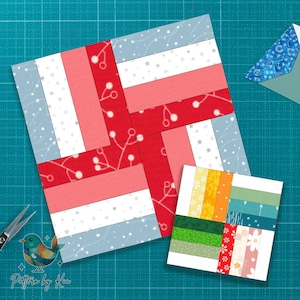 May include: Two quilt blocks with a woven design. The larger block features red, pink, white, and light blue fabrics with a snowflake pattern. The smaller block has a variety of colorful stripes. A pair of scissors and a patterned envelope are also visible.