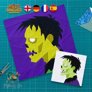 Op de afbeelding: Een quiltblokpatroon van papier met een gestileerd groen monster met zwart haar op een paarse achtergrond, vergezeld van een kleinere versie van hetzelfde grafische ontwerp op een witte achtergrond en een metalen schaar.