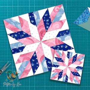 Pode incluir: Dois blocos de colcha em forma de estrela em tecidos rosa, azul e branco. O bloco maior está centrado, com uma versão menor abaixo. Os blocos estão em uma esteira de corte verde. Uma tesoura e um logotipo de pássaro estão na imagem.