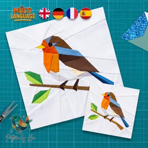 Puede incluir: Un patrón de acolchado de papel que muestra un petirrojo posado en una rama. El diseño utiliza formas geométricas en naranja, marrón, azul y verde sobre un fondo blanco. Dos versiones de la ilustración del ave aparecen sobre una rejilla verde.