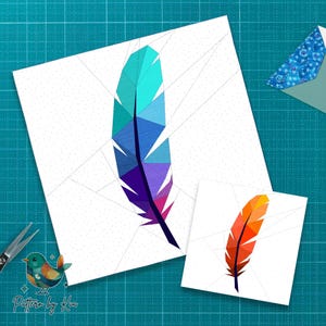 May include: Two geometric feather designs on white backgrounds. One feather is teal, blue, and purple. The other is orange and yellow. The designs are on a teal cutting mat. The text "Pattern by Kia" is in the lower left corner.