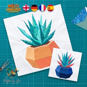 May include: Two fabric art pieces depict a geometric succulent plant in a pot. The larger piece features a teal plant in an orange pot, while the smaller one has a teal plant in a blue pot. The background is white, and the image includes the text "Multi Language".
