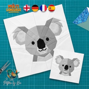 May include: Two paper piecing patterns of a koala bear in shades of gray and black. The larger koala has a detailed face and body, while the smaller one is a simplified version. The image includes the text "MULTI LANGUAGE" and a logo.