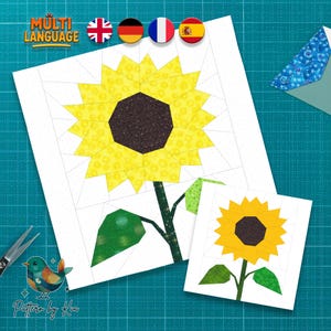 May include: Two paper quilt patterns featuring a sunflower design. The sunflowers have yellow petals and dark brown centers. The stems and leaves are green. The image includes the text "Multi Language" and flags.