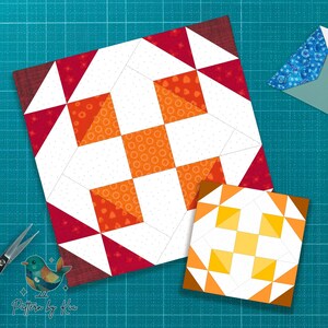 Op de afbeelding: Twee kleurrijke quiltblokken met geometrische patronen. Het grotere blok heeft rode, oranje en witte driehoeken en vierkanten. Het kleinere blok heeft een vergelijkbaar ontwerp in tinten geel en oranje. Een schaar en een envelop zijn ook zichtbaar.