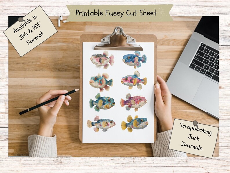 May include: A printable fussy cut sheet on a clipboard featuring eight colorful, illustrated pufferfish in various shades of blue, pink, and yellow. The sheet includes text reading Printable Fussy Cut Sheet, Available in JPG & PDF Format, and Scrapbooking Junk Journals.