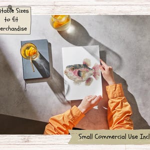 May include: A white rectangular print featuring a watercolor illustration of a pufferfish with pink and brown tones. The text "Editable Sizes to fit merchandise" appears in a top corner box, and "Small Commercial Use Incl." is at the bottom.