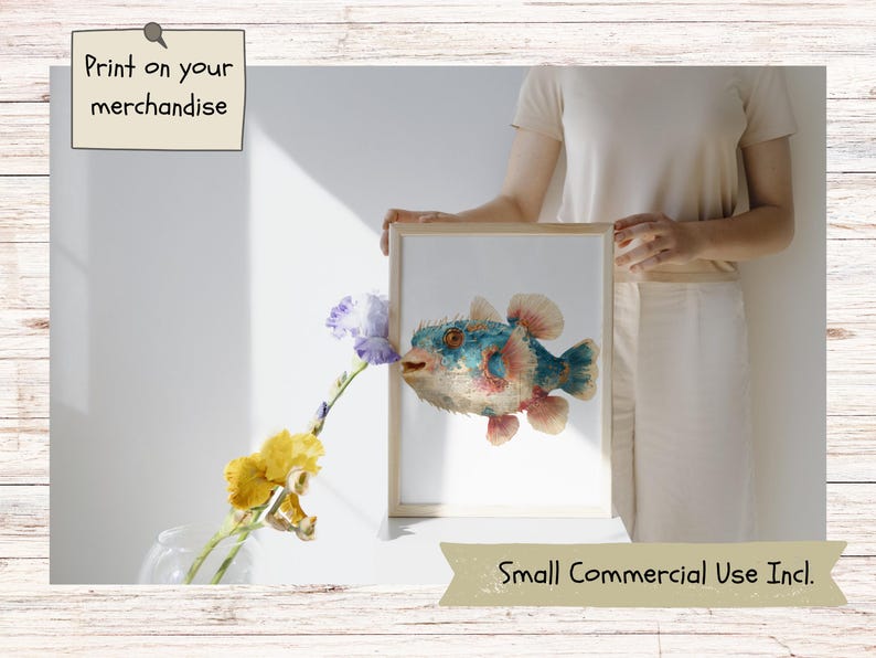 May include: A framed digital art print featuring a detailed illustration of a blue and orange pufferfish with visible spines. The artwork is displayed in a light-colored wooden frame. The text Print on your merchandise and Small Commercial Use Incl. appears.