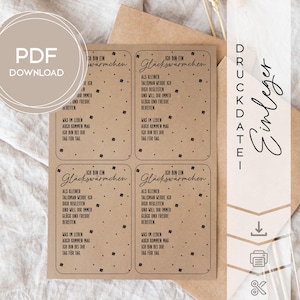 May include: A sheet of kraft paper with four printed cards. Each card features the text "Ich bin ein Glückswärmchen" and other German text. The cards are decorated with small clover-like shapes and are labelled "PDF Download".