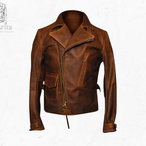 May include: A brown leather jacket with an asymmetrical zipper closure, a notched collar, and multiple pockets. The jacket has a vintage, distressed look and features the text "MR KRAFTER LEATHER SPECIALIST".