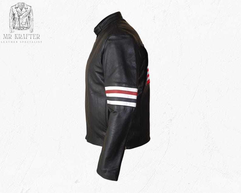 May include: Black leather jacket with a stand-up collar and a design on the sleeve featuring red and white stripes. The jacket has a classic motorcycle style. The brand name "MR KRAFTER LEATHER SPECIALIST" is visible in the upper left corner.