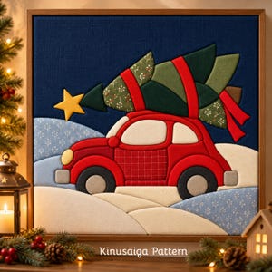 May include: A fabric wall art piece featuring a Kinusaiga pattern of a red car carrying a green Christmas tree on its roof. The scene includes a yellow star, a dark blue sky, and white snowy hills, all framed in a wooden border.