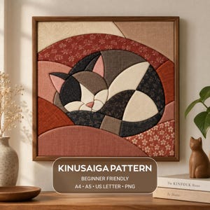 May include: A square Kinusaiga fabric art piece featuring a stylized sleeping cat composed of various textured fabric patches in shades of black, cream, and rust red. The artwork is framed in wood and includes text: KINUSAIGA PATTERN BEGINNER FRIENDLY A4 A5 US LETTER PNG.