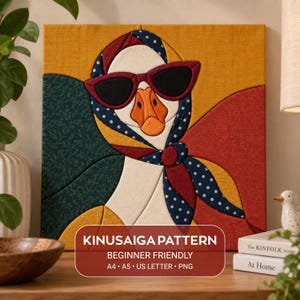 May include: A square fabric art piece featuring a goose wearing dark sunglasses and a blue polka-dot headscarf. The background consists of geometric sections in mustard yellow, dark green, and red. Text reads: KINUSAIGA PATTERN BEGINNER FRIENDLY A4 A5 US LETTER PNG.