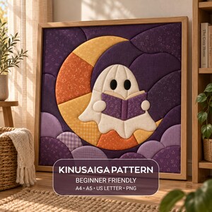 May include: A Kinusaiga pattern wall art piece featuring a white ghost reading a purple book while sitting on a yellow crescent moon against a dark purple background. The text reads: KINUSAIGA PATTERN, BEGINNER FRIENDLY, A4, A5, US LETTER, PNG.