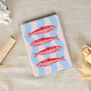 May include: A rectangular decorative tray with four red fish illustrations on a light blue and white wavy background. The fish have detailed fins and scales. The tray has a light pink border.