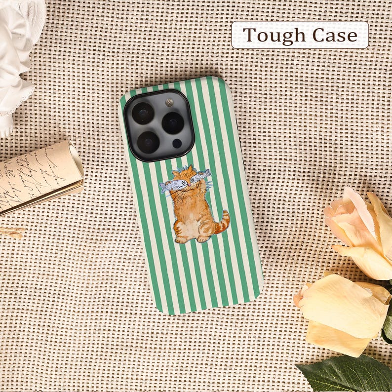 May include: A phone case with a green and white striped design. It features an illustration of a ginger cat holding two fish. The text "Tough Case" is displayed in a white rectangle at the top.