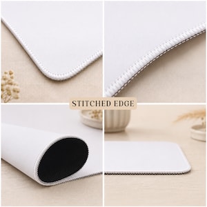 Puede incluir: Una alfombrilla de rat&oacute;n rectangular blanca con un borde cosido duradero. La superficie es lisa y blanca, mientras que la parte inferior es negra y texturizada. El texto STITCHED EDGE es visible en el centro de la imagen.