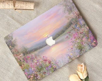 May include: A laptop cover featuring an impressionistic landscape painting of a sunset over a calm lake, surrounded by vibrant wildflowers in shades of pink, purple, and green, with a central cutout for the Apple logo on the device surface.