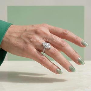 Stunning personalized 14k gold bridal jewelry ideal for a modern wedding band stack. This custom bespoke engagement ring captures the essence of a romantic proposal. The art deco aesthetic and floral halo design complete the perfect wedding set. Essential ethical bridal gem, vintage bridal set, custom anniversary token, bespoke bridal gem, brilliant cut bridal, and regal bridal piece.