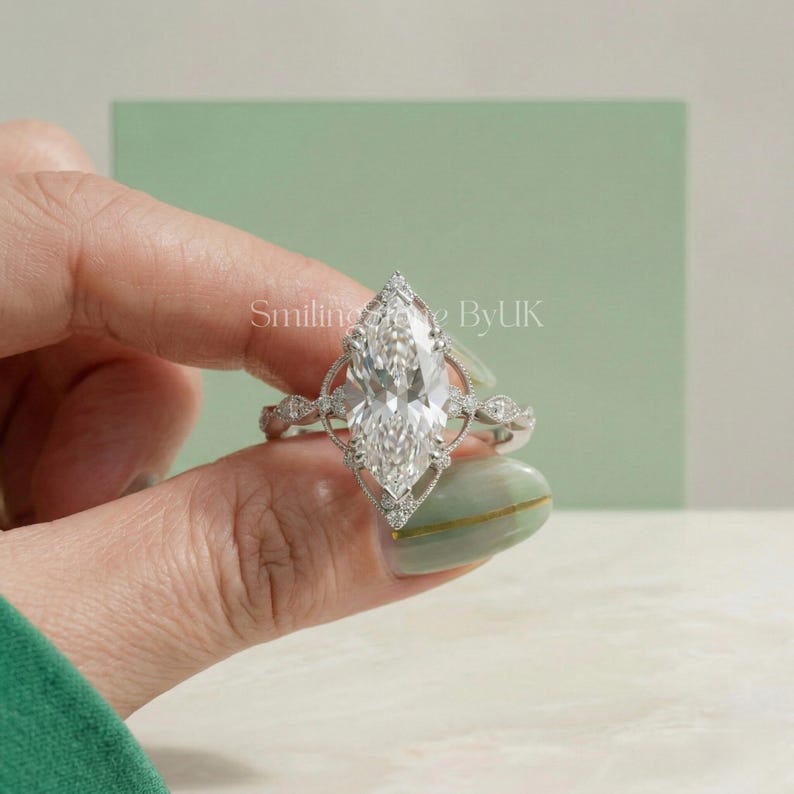 A personalized luxury look statement ring glowing in natural light. This custom bespoke lab diamond piece exemplifies the quiet luxury aesthetic. Trendy jewelry that perfectly balances affordable luxury with vintage art deco style. Features ornate milgrain set, fancy cut bridal gem, sustainable lab stone, handmade USA style, custom anniversary gift, and bespoke statement piece.