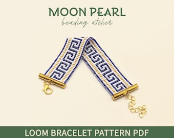 May include: A loom bracelet pattern PDF with a blue, white, and gold Greek key design. The bracelet has gold-colored metal end pieces and a clasp. The text "MOON PEARL beading atelier" and "LOOM BRACELET PATTERN PDF" are visible.