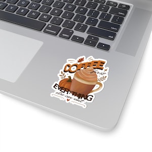 May include: A die-cut sticker featuring a brown mug of coffee with whipped cream, an orange pumpkin, and autumn leaves. The text reads COFFEE first EVERYTHING else can wait in brown and orange lettering with a small heart at the bottom.