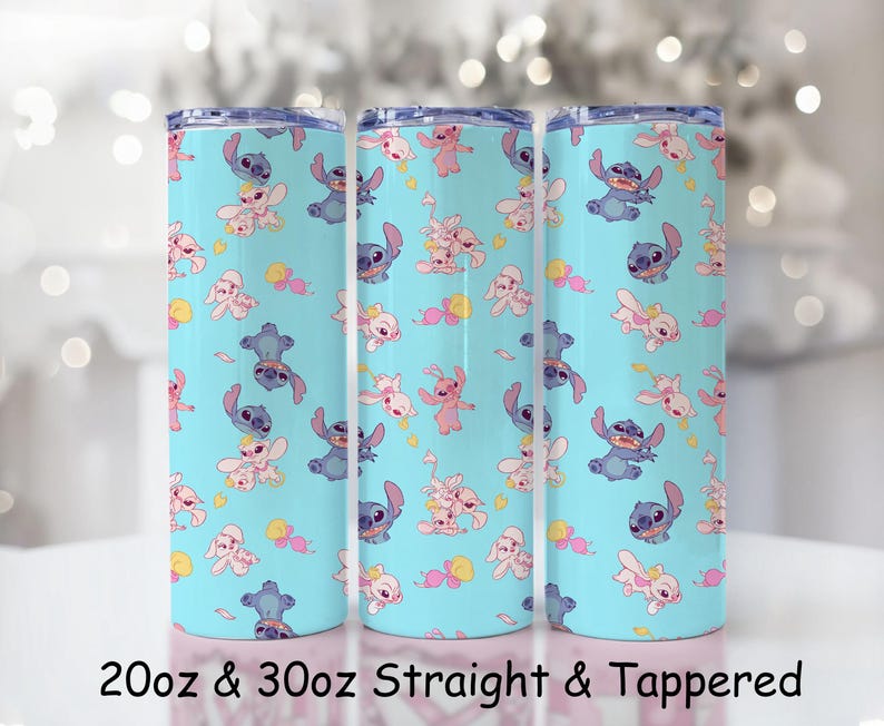May include: Three cylindrical tumblers with a light blue background featuring a repeating pattern of blue and pink cartoon characters. The text at the bottom reads 20oz & 30oz Straight & Tappered. Each tumbler has a silver-toned rim and a clear lid.