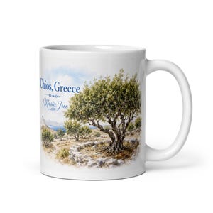 May include: A white ceramic mug featuring a watercolour illustration of a mastic tree in Chios, Greece. The design includes a stone wall surrounding the tree, a blue sky, and the blue text Chios, Greece and Mastic Tree printed on the side.