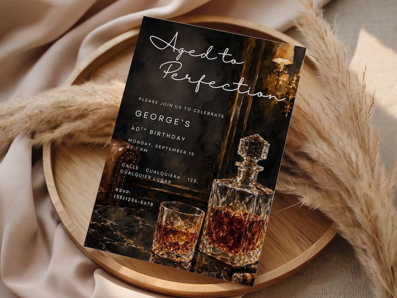 May include: Aged to Perfection birthday invitation card featuring a whiskey decanter and glass. The invitation includes the text "Aged to Perfection" and details for George's 40th birthday, including the date, time, and location.
