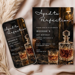 May include: An invitation and a smartphone displaying the same design. The design features the text "Aged to Perfection" and details for a 40th birthday celebration, including a crystal decanter and a glass of amber liquid.