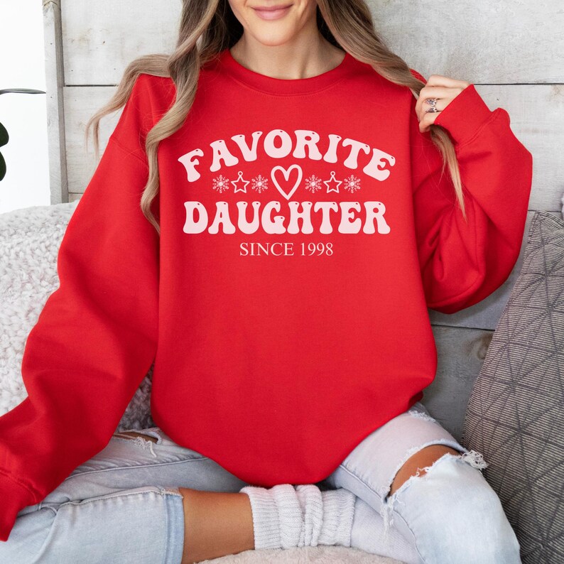 May include: A set of three ceramic nesting bowls. The largest bowl is light blue, the medium bowl is white, and the smallest bowl is a darker blue. Each bowl has a smooth, glossy finish.